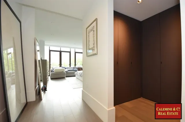 a bedroom with a large bed and a couch