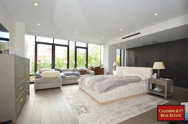 a bathroom with a bathtub sink and mirror
