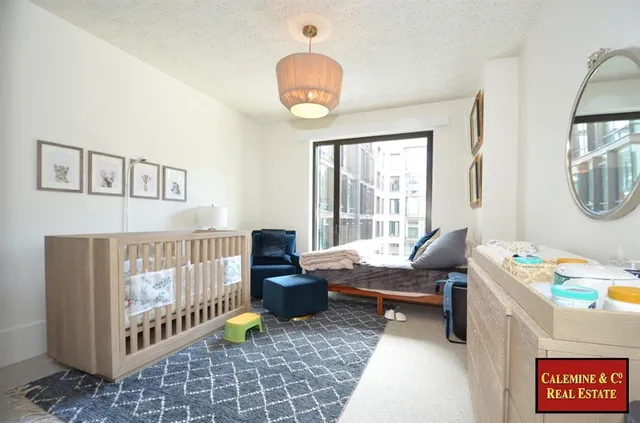 a bathroom with a tub sink toilet and a mirror