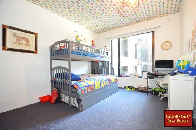 a lobby with furniture and a potted plant