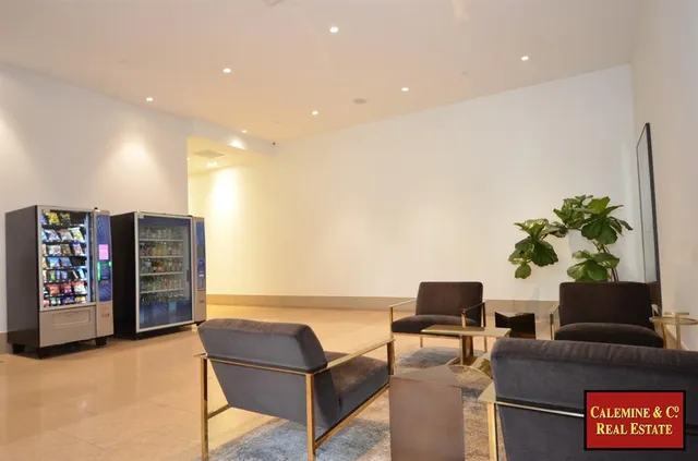 a kitchen with granite countertop sink and natural light