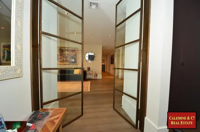 a view of living room with furniture and large window
