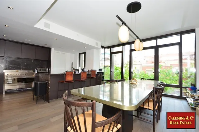 a dining room with furniture and window