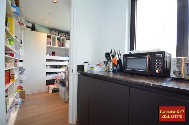 a view of a workspace with furniture