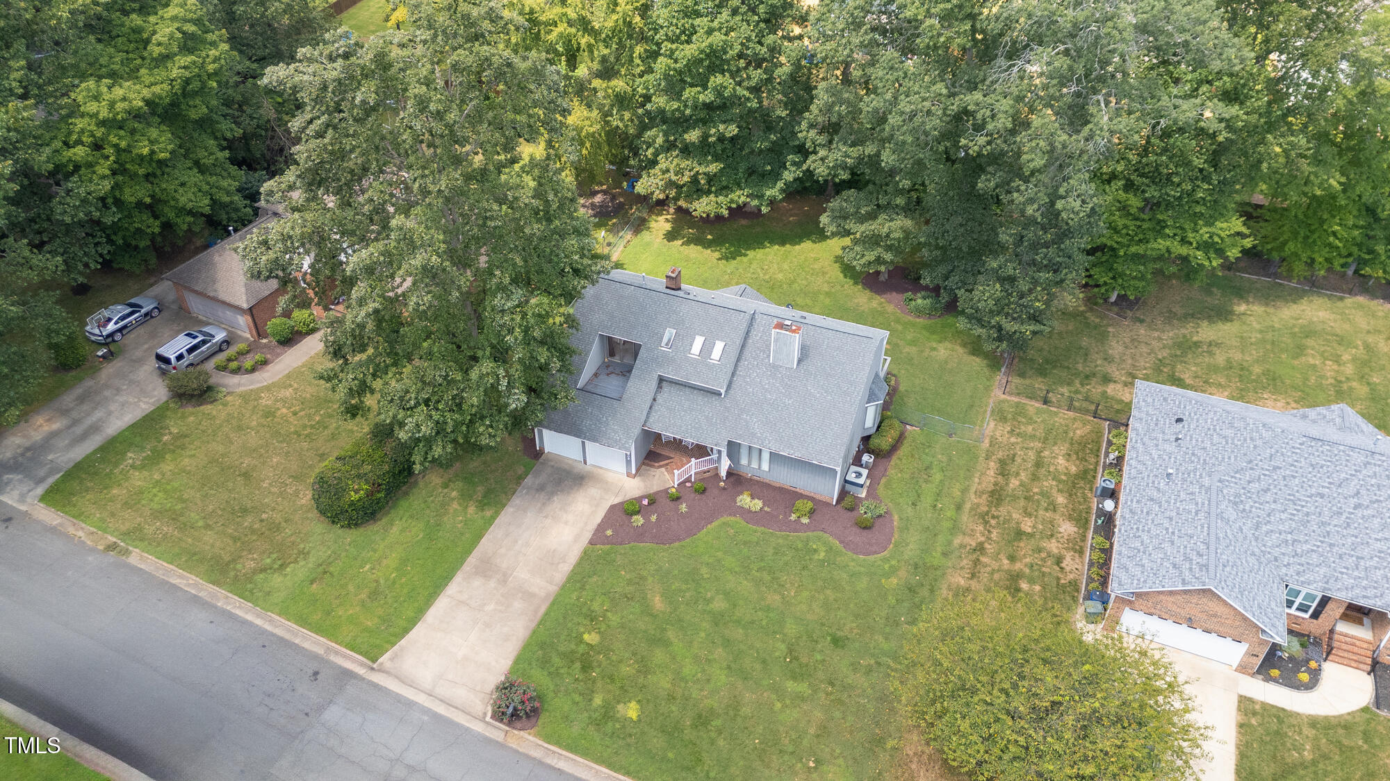 809 Brookview Drive Elon, NC 27244 - Photo 38 of 53 an aerial view of a house with garden space and street view