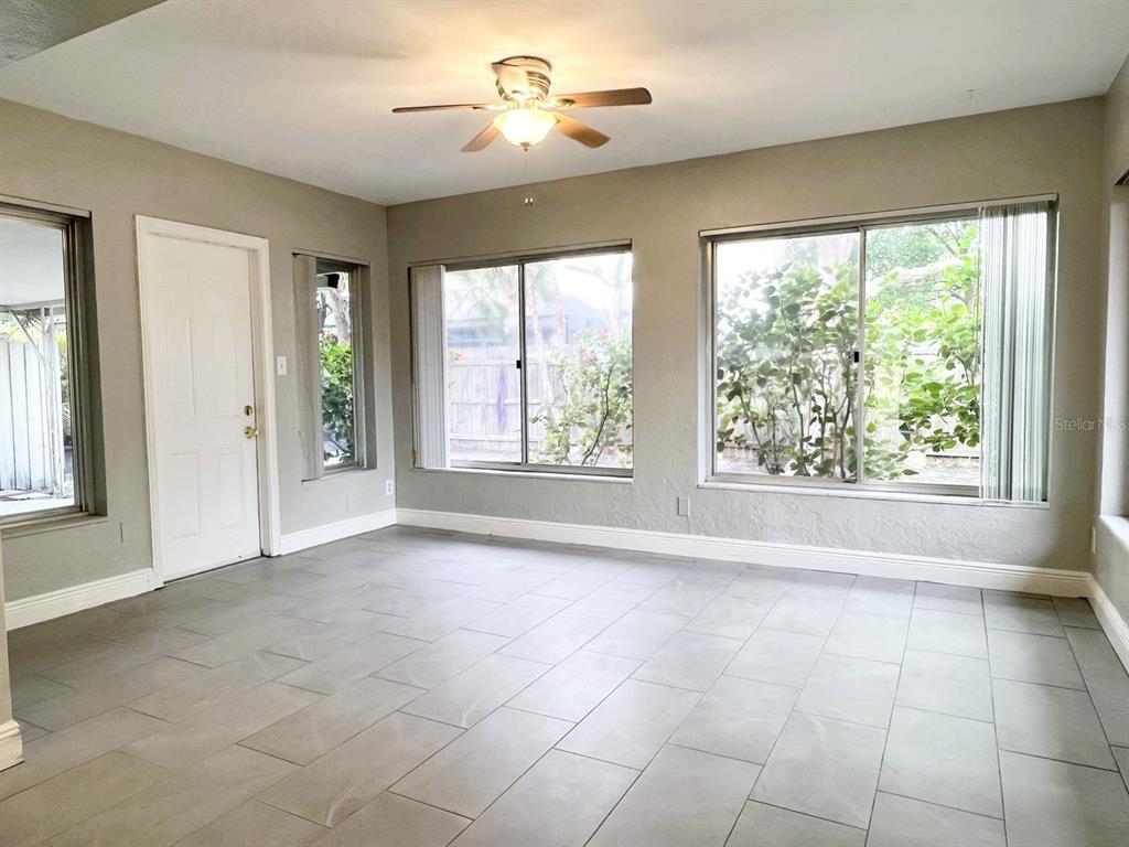 2489 Del Rio Way Dunedin, FL 34698 - Photo 12 of 24 a view of an empty room with a window