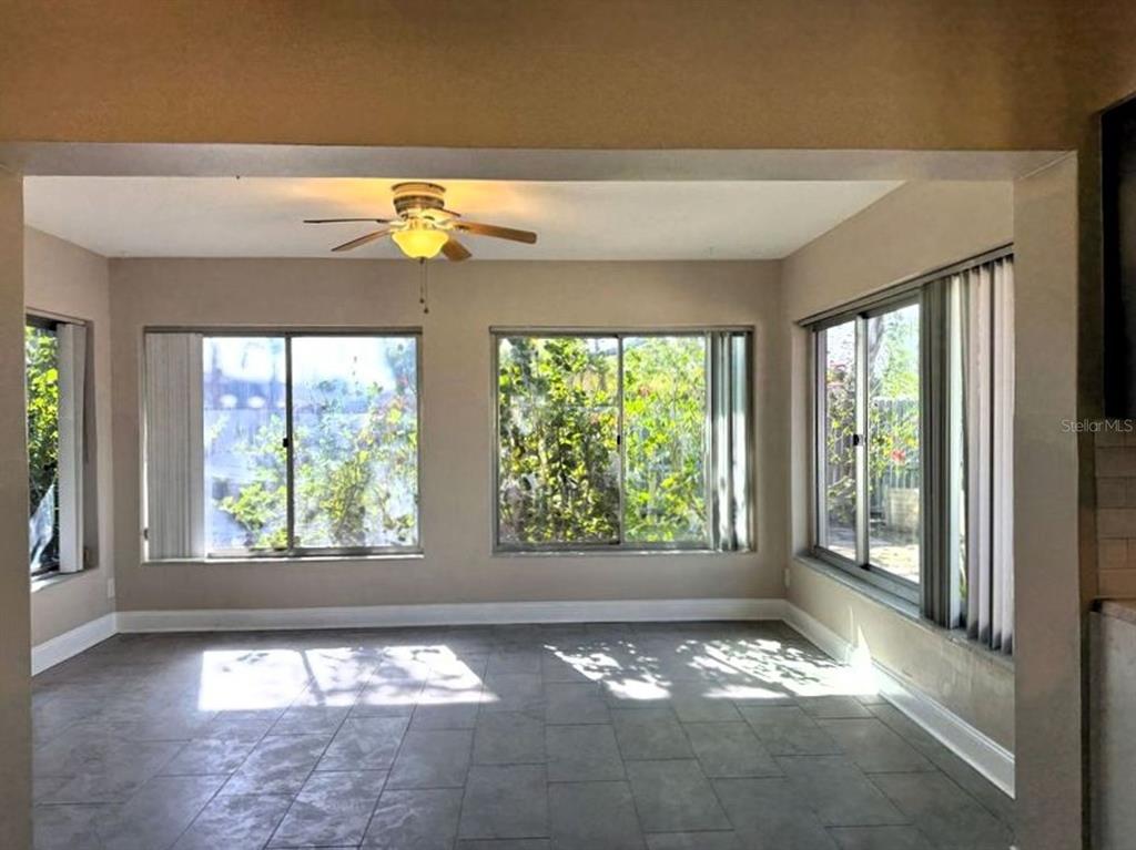 2489 Del Rio Way Dunedin, FL 34698 - Photo 13 of 24 a view of an empty room with a window