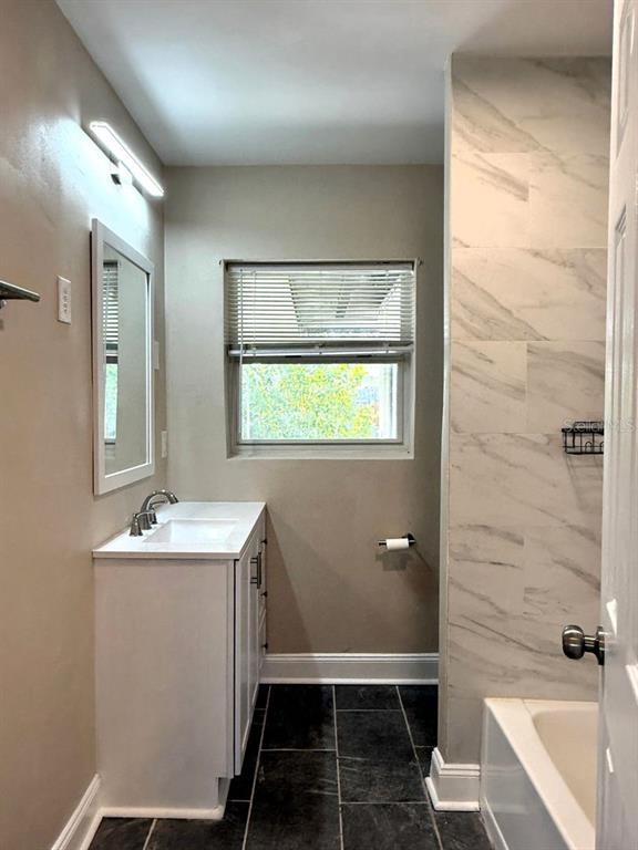 2489 Del Rio Way Dunedin, FL 34698 - Photo 15 of 24 a bathroom with a sink toilet and shower