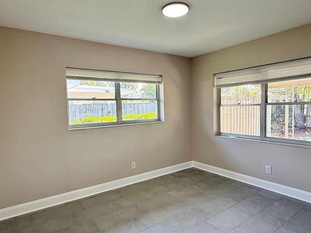 2489 Del Rio Way Dunedin, FL 34698 - Photo 17 of 24 an empty room with windows