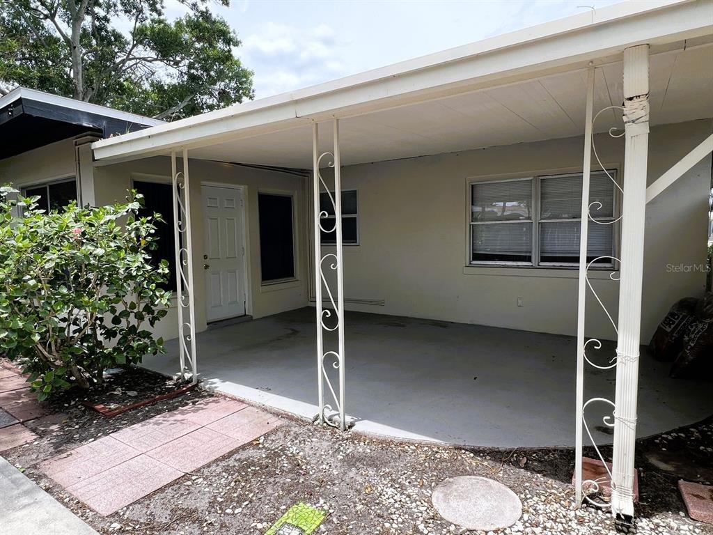 2489 Del Rio Way Dunedin, FL 34698 - Photo 2 of 24 an outdoor space with porch