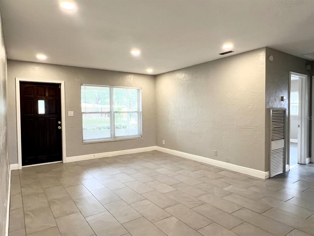 2489 Del Rio Way Dunedin, FL 34698 - Photo 5 of 24 an empty room with windows and closet