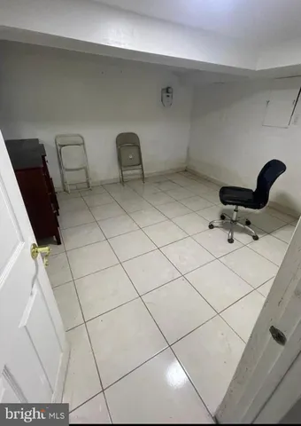 a bathroom with a sink and glass door