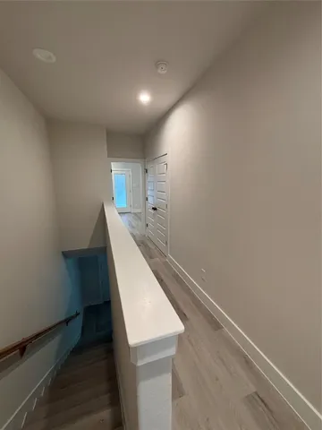 a view of hallway with washer and dryer