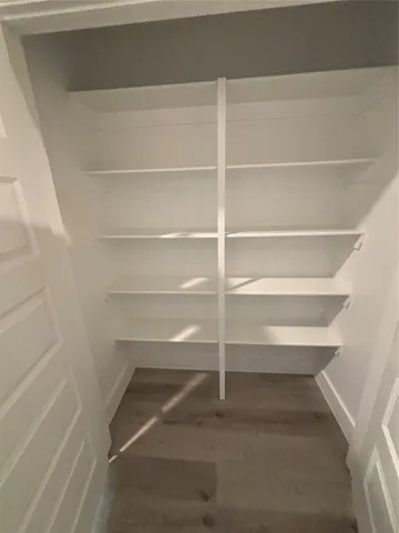 a view of an empty walk in closet