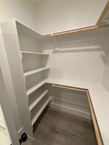a view of an empty walk in closet