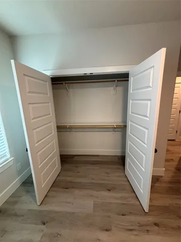 a view of an empty walk in closet