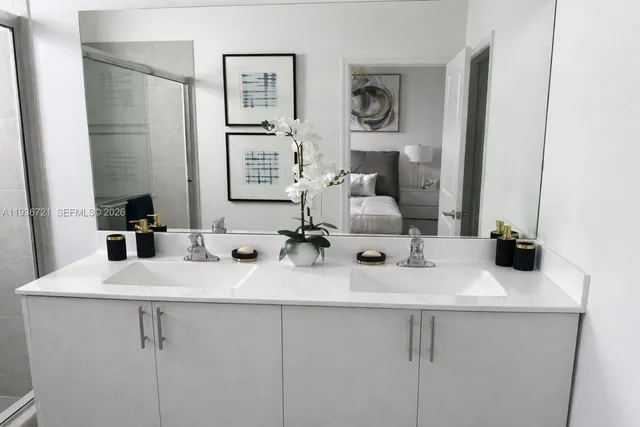 a bathroom with a sink and a mirror