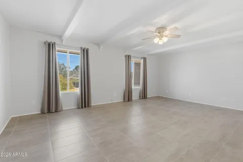a view of an empty room with a kitchen
