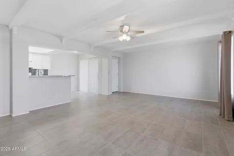 a kitchen with stainless steel appliances granite countertop a refrigerator a stove a sink and a microwave