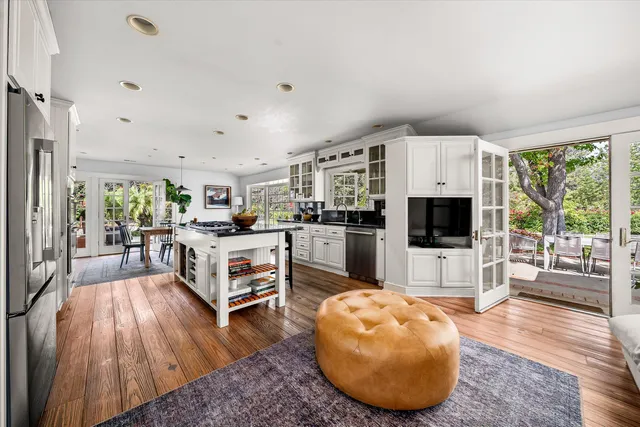 a kitchen with stainless steel appliances granite countertop a stove and a center island