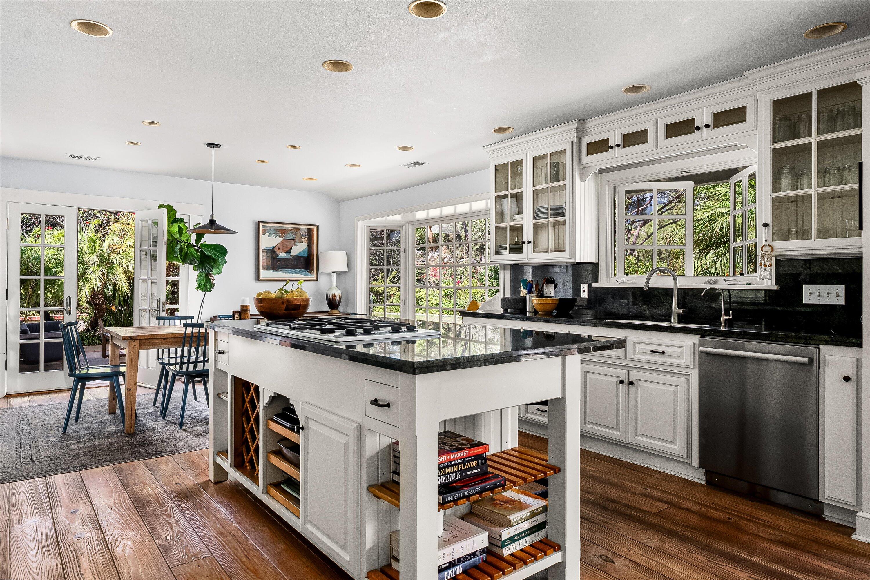 1192 Edward Place Goleta, CA 93111 - Photo 16 of 29 a kitchen with stainless steel appliances granite countertop a stove and a center island