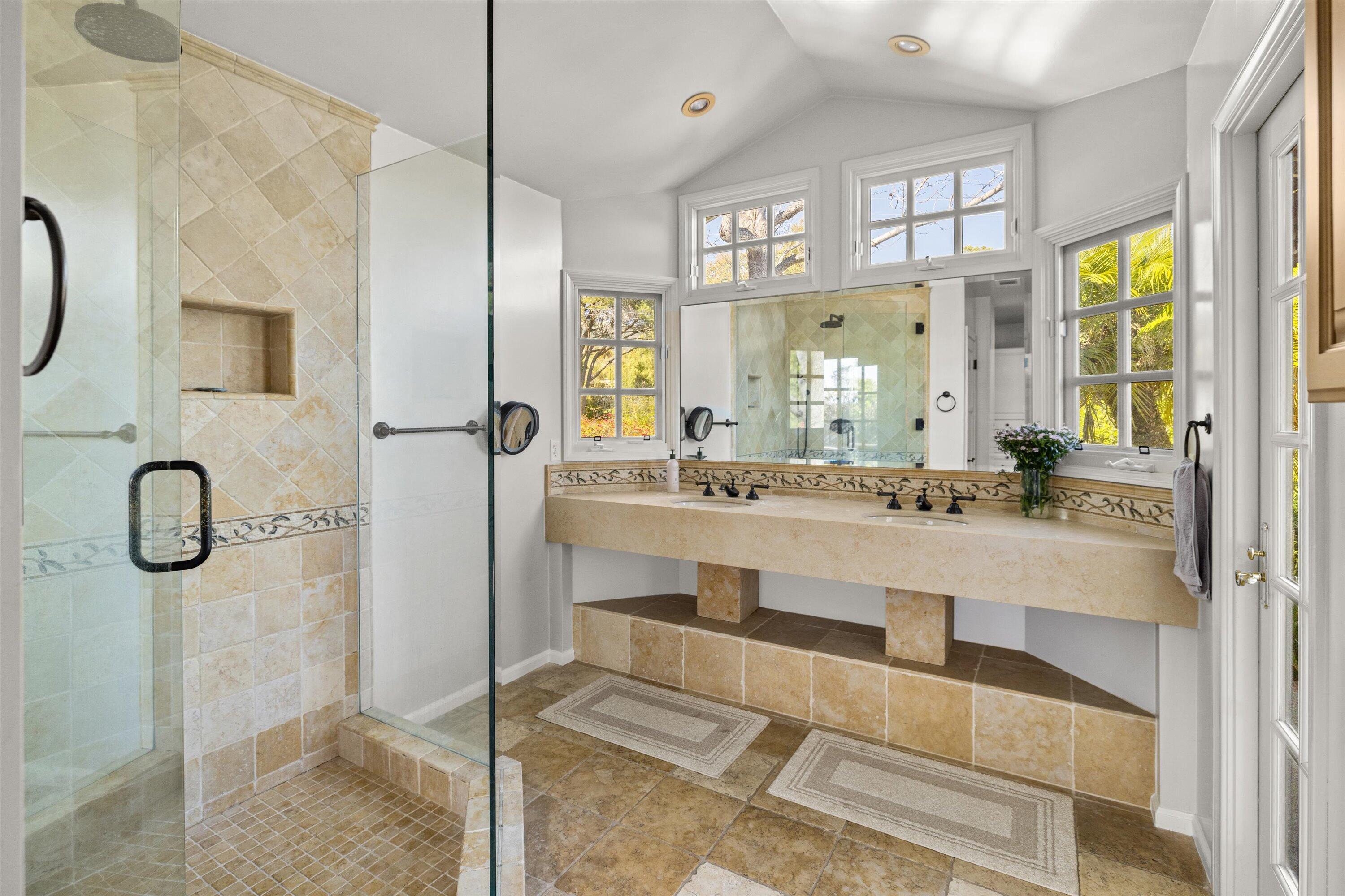 1192 Edward Place Goleta, CA 93111 - Photo 24 of 29 a bathroom with a tub sink and mirror