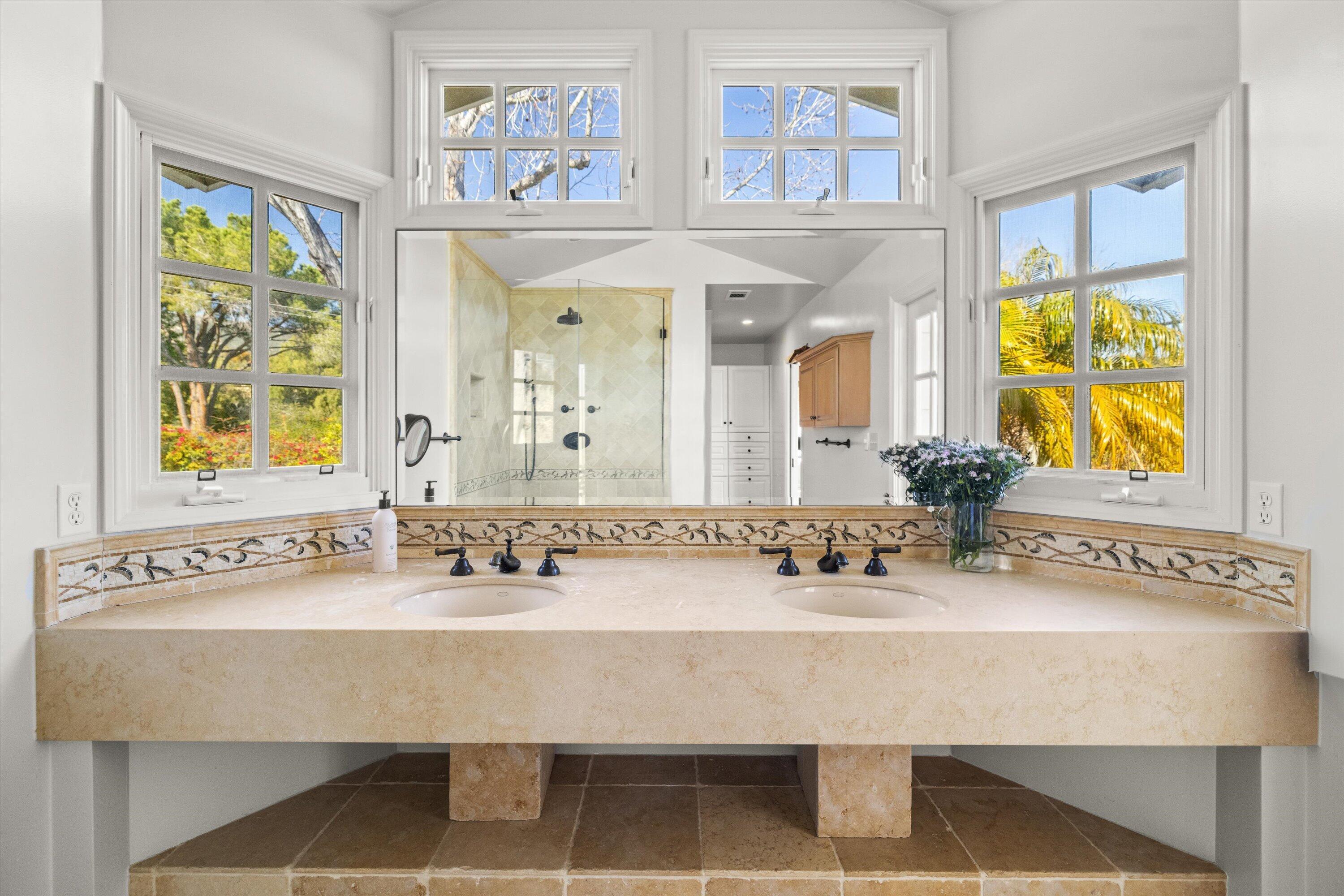 1192 Edward Place Goleta, CA 93111 - Photo 25 of 29 a bathroom with a sink and a mirror