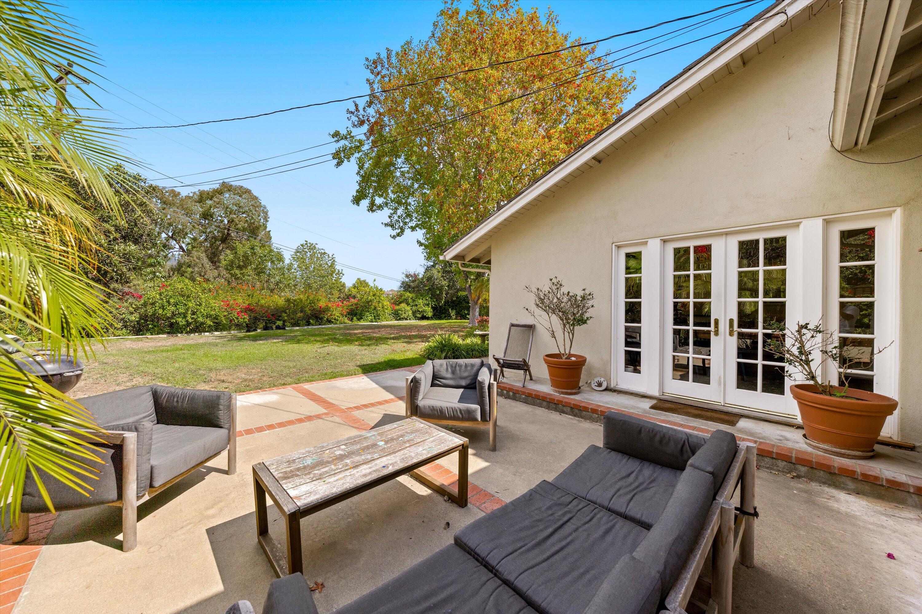 1192 Edward Place Goleta, CA 93111 - Photo 27 of 29 a view of a patio with couches table and chairs and potted plants