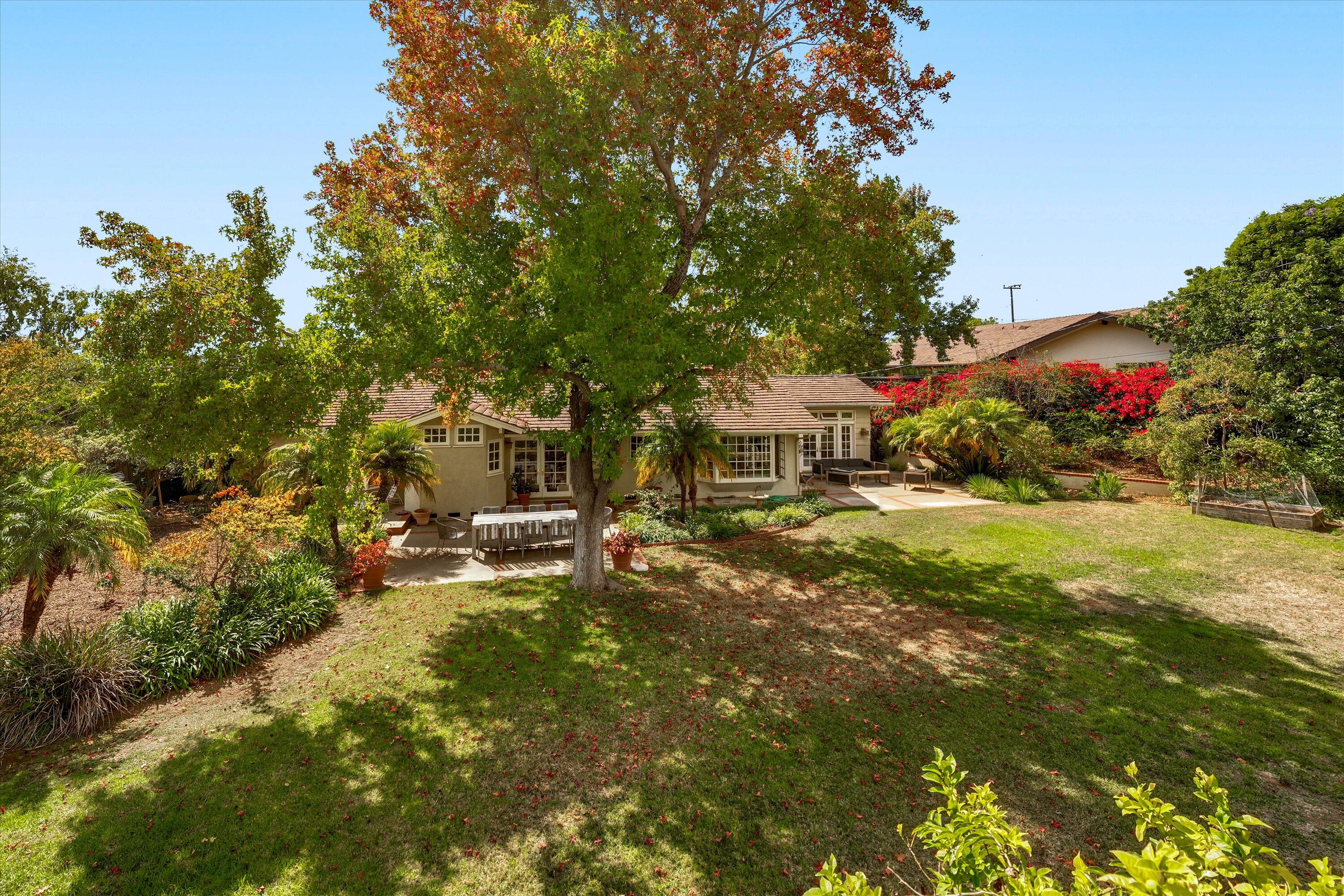 1192 Edward Place Goleta, CA 93111 - Photo 3 of 29 a view of a garden with plants and large trees