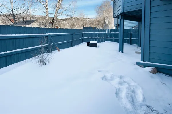 a bench sitting in front of a door