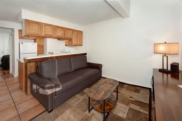 a living room with furniture and a table