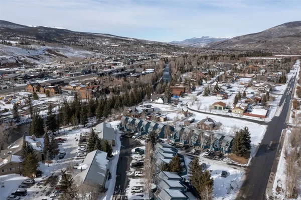 an aerial view of a residential houses and city street