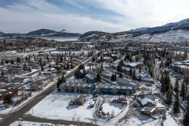a view of a city street with tall buildings