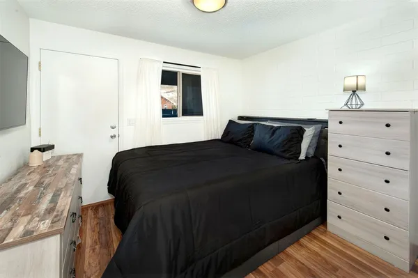 a bedroom with a bed and a closet