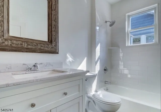a bathroom with a sink a toilet and a bathtub