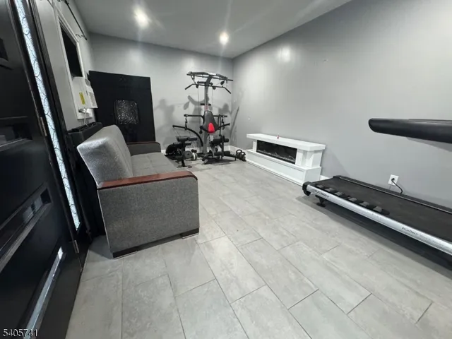 a room with furniture and a flat screen tv