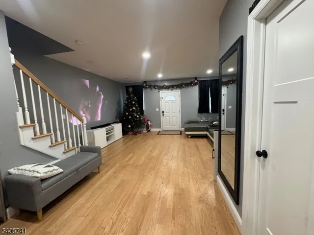 a view of a livingroom with furniture and stairs