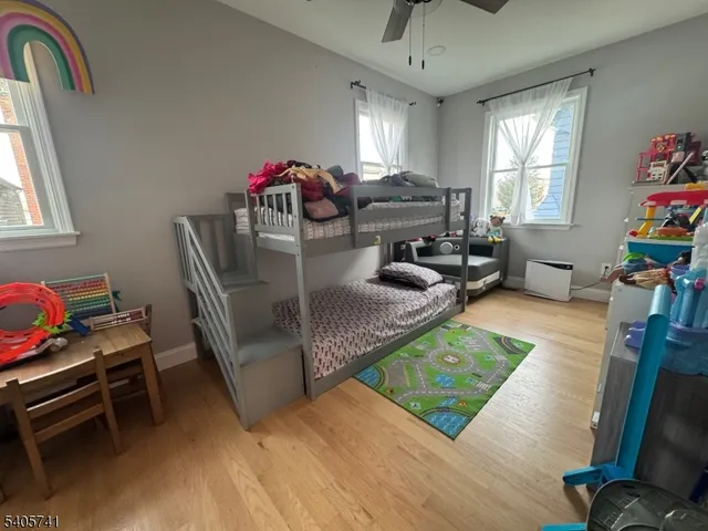a living room with furniture rug and a window