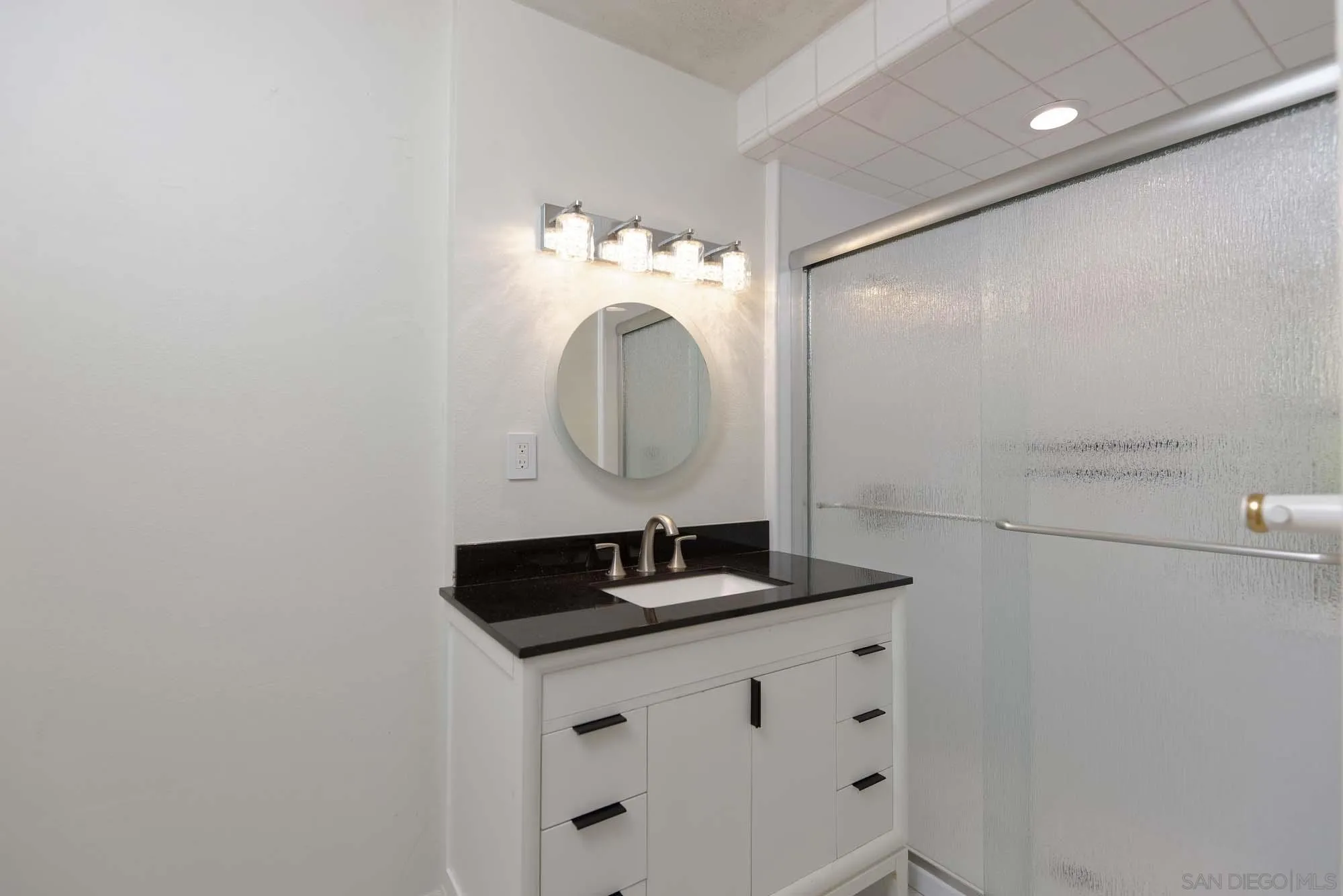 2075 Caminito Circulo Sur La Jolla, CA 92037 - Photo 12 of 26 a bathroom with a sink and a mirror