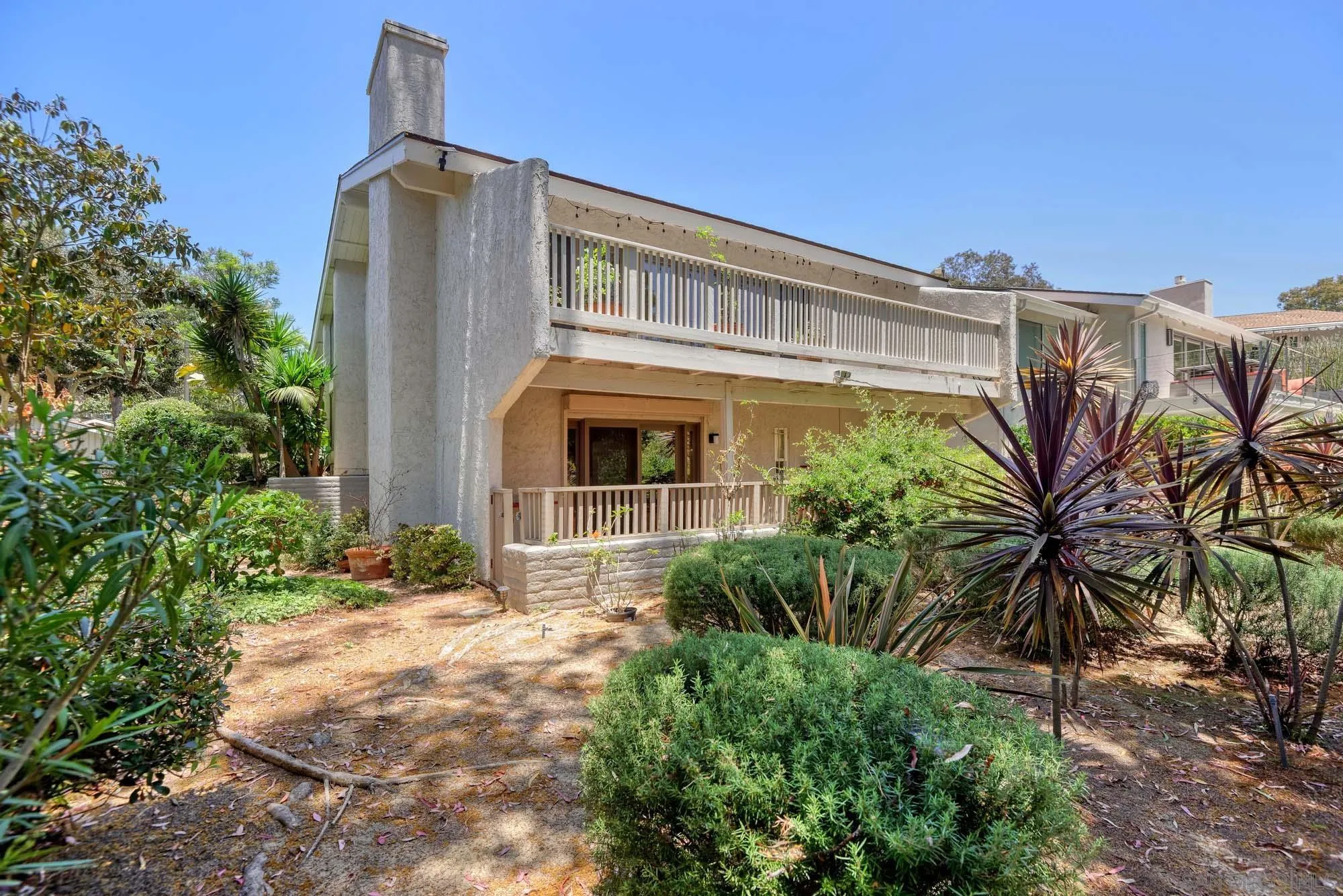 2075 Caminito Circulo Sur La Jolla, CA 92037 - Photo 17 of 26 a front view of a house with a yard