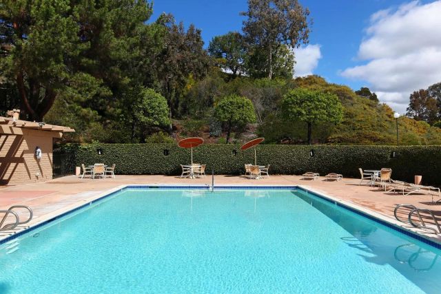 a view of a swimming pool with lounge chair