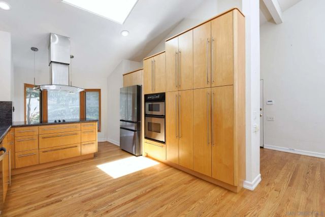 a spacious bathroom with a large mirror and a shower
