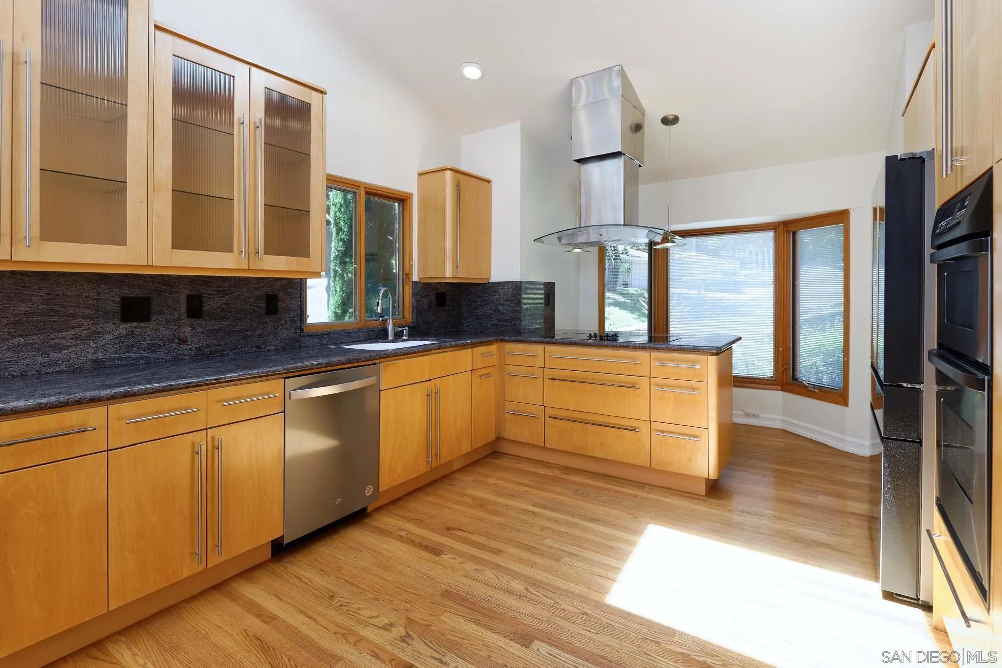 2075 Caminito Circulo Sur La Jolla, CA 92037 - Photo 4 of 26 a kitchen with stainless steel appliances granite countertop a sink a stove and a refrigerator