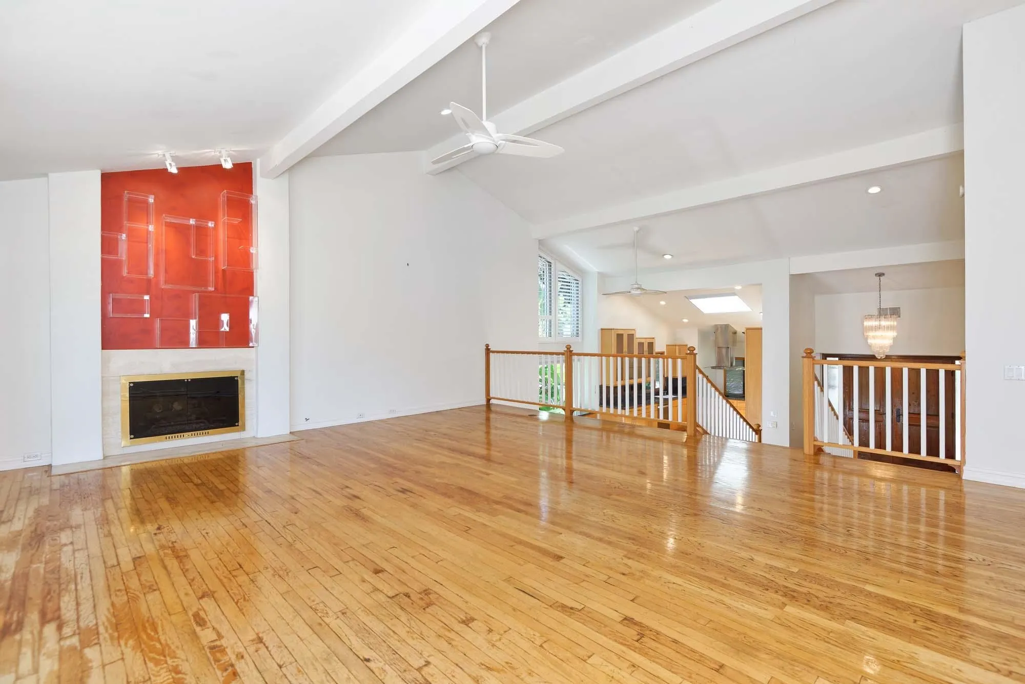 2075 Caminito Circulo Sur La Jolla, CA 92037 - Photo 7 of 26 a view of an empty room with wooden floor and a bathroom