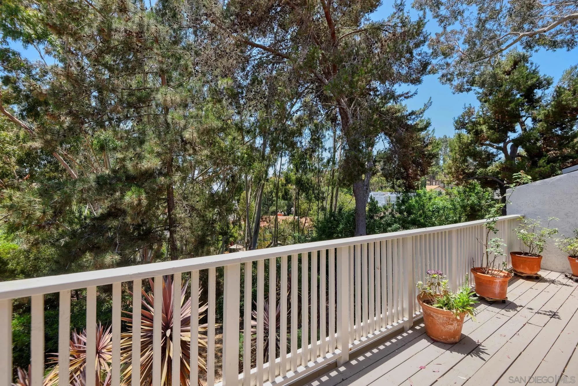 2075 Caminito Circulo Sur La Jolla, CA 92037 - Photo 9 of 26 a balcony with wooden floor and outdoor space