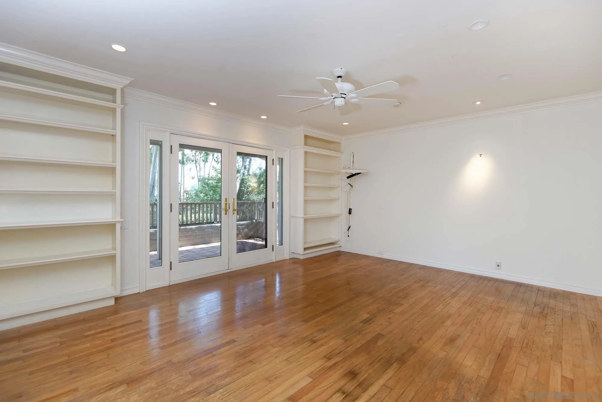 2075 Caminito Circulo Sur La Jolla, CA 92037 - Photo 10 of 26 a view of an empty room with a window and wooden floor