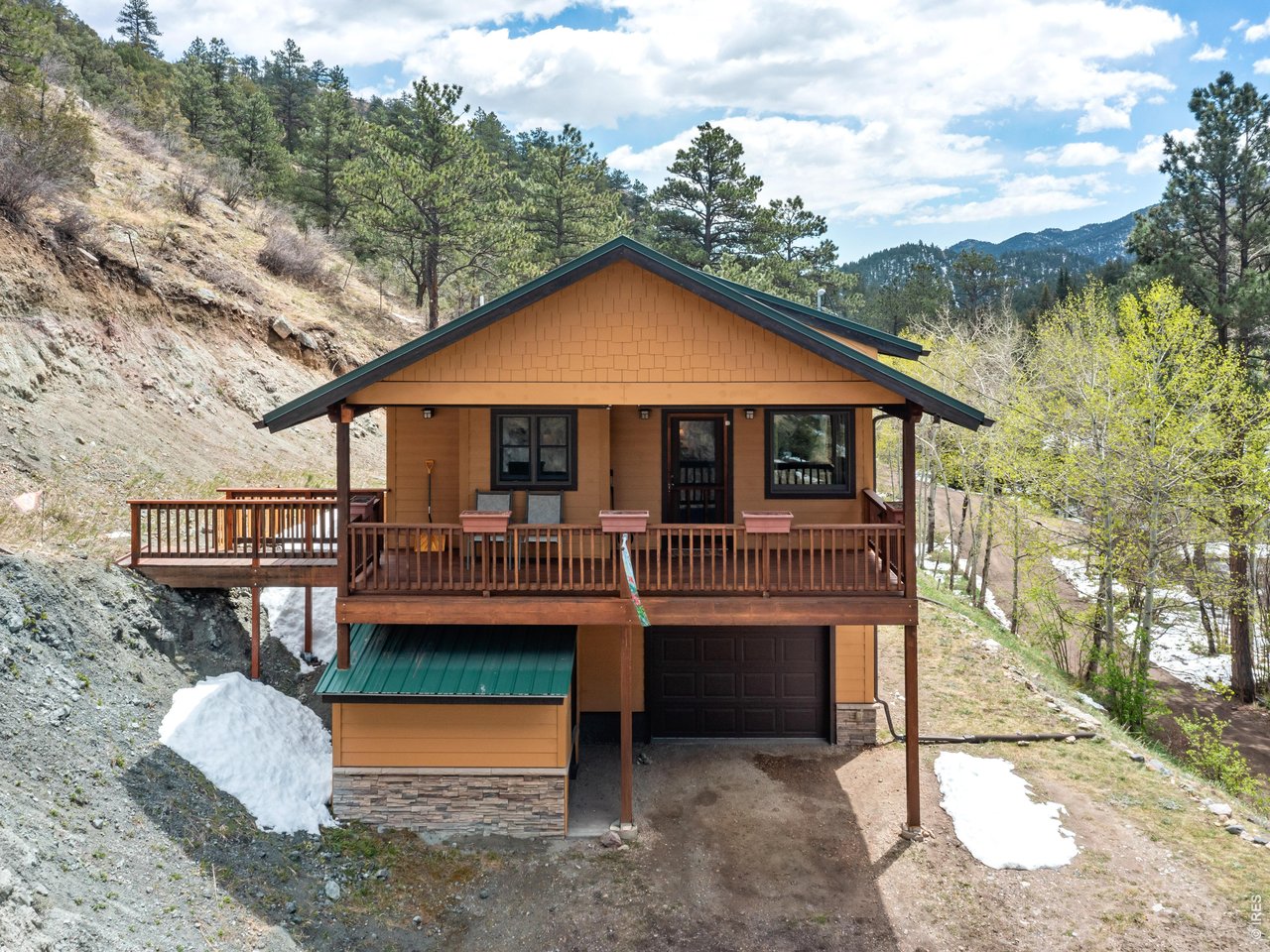 1002 Streamside Drive Drake, CO 80515 - Photo 2 of 37 a view of a house with a yard and sitting area