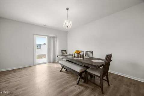 a kitchen with stainless steel appliances kitchen island granite countertop a refrigerator and a stove top oven