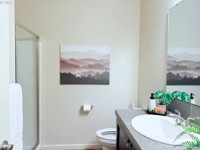 a bathroom with a toilet and a sink
