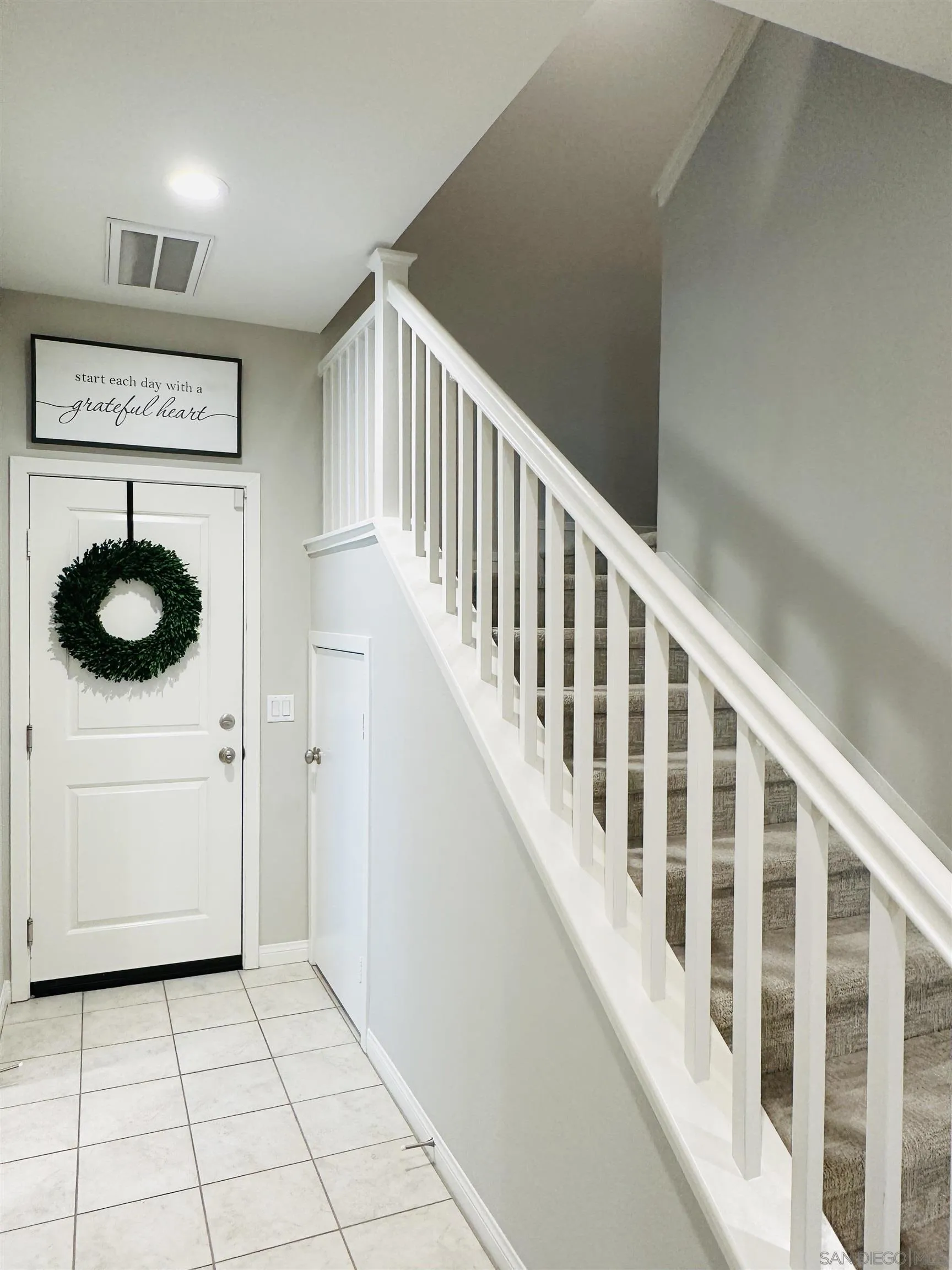 4309 Star Path Way, Unit 2 Oceanside, CA 92056 - Photo 17 of 32 a view of entryway and hall with a window